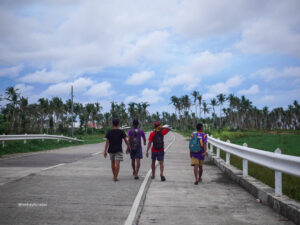 siargao locals walking down the road